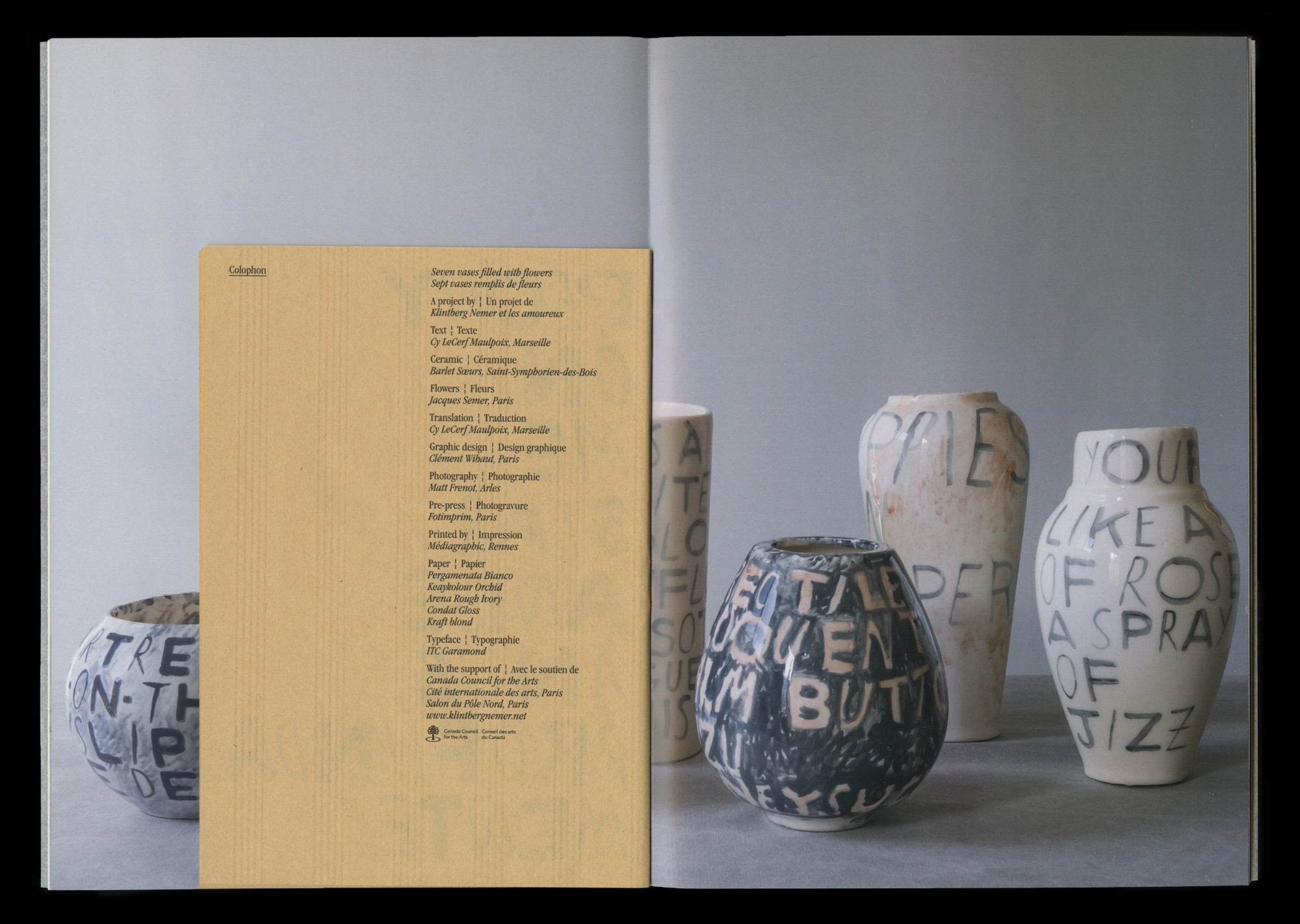 Seven vases filled with flowers 11